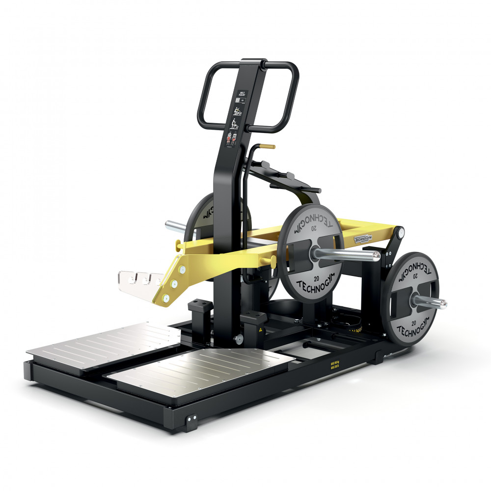 Тренажер для приседаний Technogym Pure Belt для тренажерного зала: интенсивная тренировка квадрицепсов для максимального развития ягодиц.